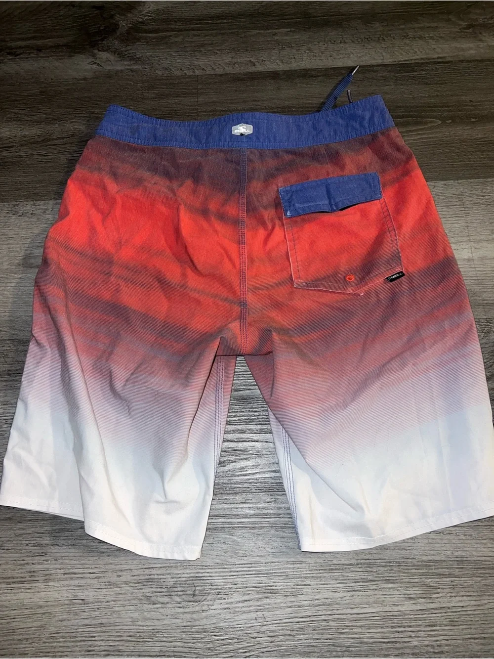 O'Neill Red-to-White Ombre Board Shorts with Blue Waistband